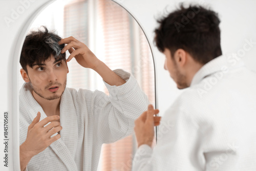 Young man with graying hair...