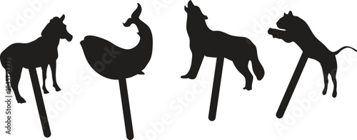 Silhouette animal figures on sticks