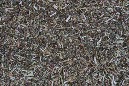 A Close-Up of Dried Meadowsweet Herb Chopped and Arranged on a Neutral Surface, Highlighting Its Natural Texture and Color for Herbal Use