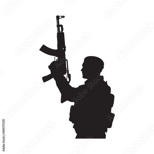 Silhouette of a soldier holding an ak 47 rifle in a dark background