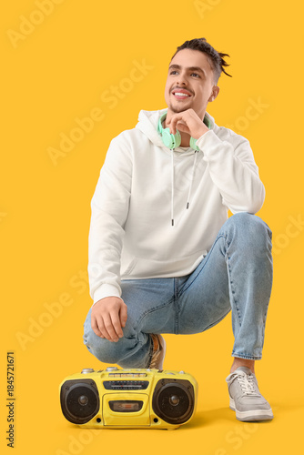 Young man with boombox on y...