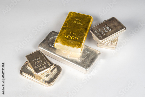 Gold and Silver Bars on white table top view