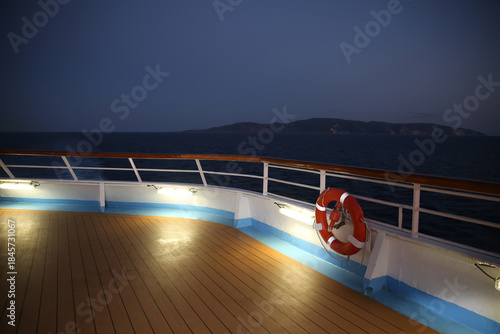 Twilight over a cruise ship deck; a relaxing way to travel, sailing across the calm ocean.
