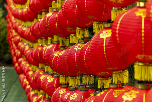 View of vibrant red lanterns with golden tassels create a mesmerizing spectacle of color and tradition, casting a warm glow, Kuala Lumpur, Federal Territory of Kuala Lumpur, Malaysia.