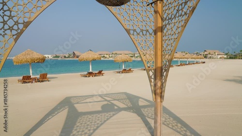 Arabesque Wooden Arch Overlooking Beach Resort
