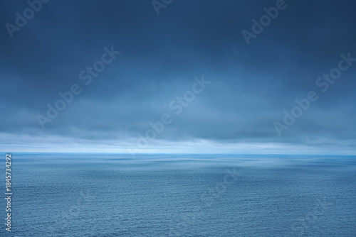 A panoramic aerial view of the Pacific Ocean with low-flying dense clouds obscuring the sky, Muroran, Hokkaido, Japan