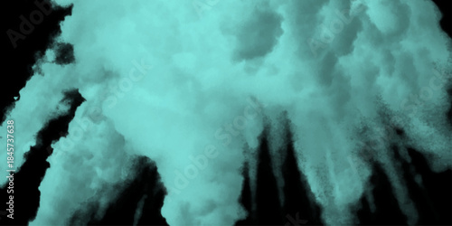 Abstract emerald, green smoke background for artistic design projects. Turquoise smoke clouds swirling on a dark background. Mysterious green smoke swirling in darkness creating an atmospheric.