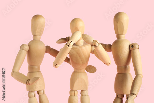 Wooden mannequins hugging o...