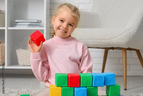 Cute little girl with plast...