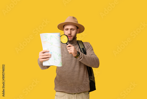 Young male tourist with mag...