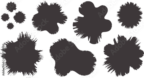 Black irregular ink blot shapes white