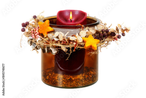 Isolated christmas deco with a burning candle