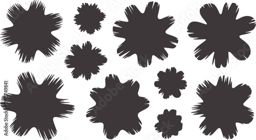 Nine black irregular inkblot shapes white inkblots