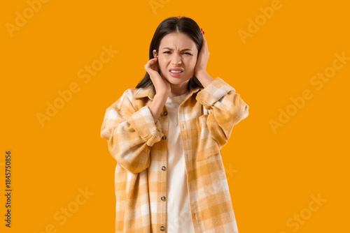 Young woman with otitis on ...