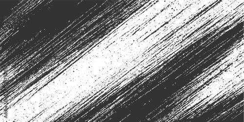 Abstract dark grey brush strokes and speckles on white background diagonal textured pattern grunge paint