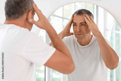 Mature man doing face build...