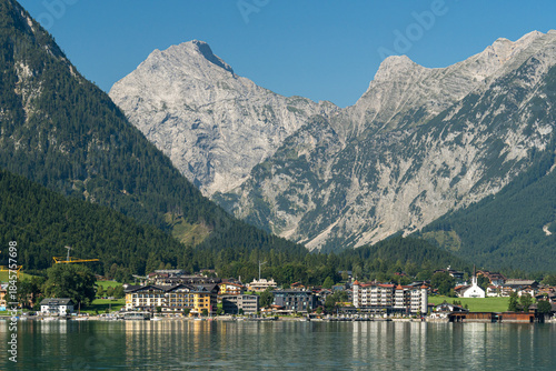 Panoramic view of Pertisau, a small town on the shore of Lake Achensee, with the Karwendel Mountains behind, in the Tyrol region of Austria