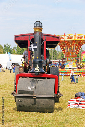 	
Vintage Steam Traction engine in a field	