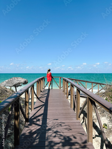 Woman on a Pier Overlooking the Ocean