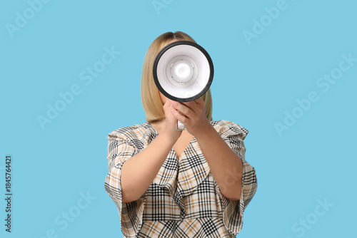 Mature woman with megaphone...