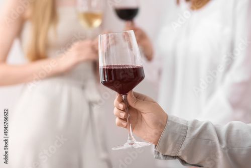Female hand with glass of e...