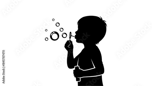 Silhouette of a young child blowing bubbles, a playful and innocent moment captured in black and white.