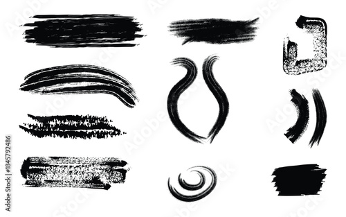 Collection of black brush strokes and swirls on white background