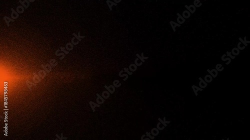 Abstract orange particle dust effect on dark background animation loop