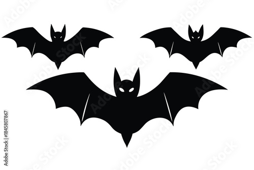 Three black silhouette bats flying