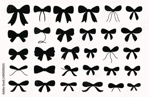 Collection of various black bow ties and bows
