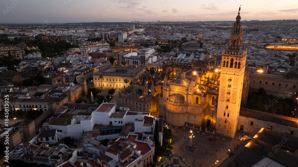 Obraz premium Night time aerial view of the historic old town city center of Seville, Andalusia, Spain.