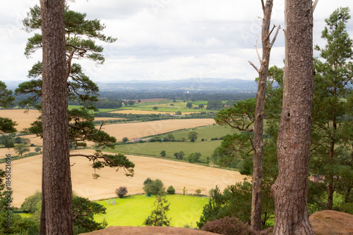 Our green and pleasant land, view over the Shropshire countryside towards the Welsh mountains from a hill top near Shrewsbury .
