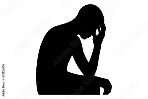 Silhouette of a man sitting in deep thought and contemplation