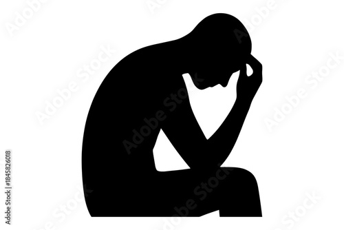 Silhouette of a person in deep thought sitting on a chair