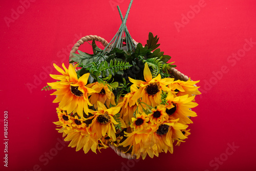 Minimal floral arrangement on red surface