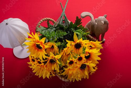 Minimal floral arrangement on red surface