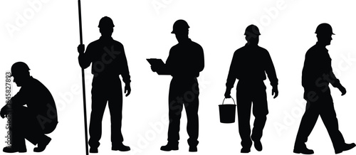 Silhouettes of construction workers in different poses with tools equipment