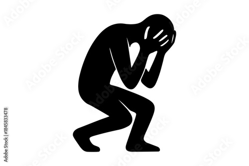 Silhouette of person holding head in hands expressing sadness or stress