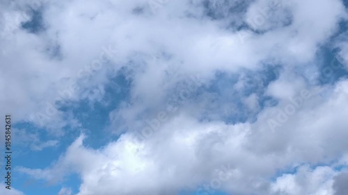 Very small dark clouds moving across the sky