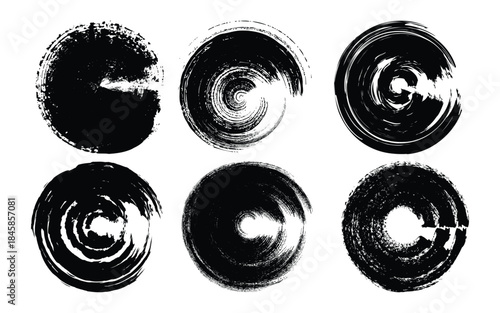 Six black and white circular objects with reflective surfaces