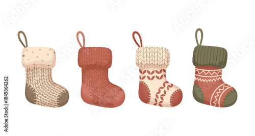 Four cozy knitted Christmas stockings with festive patterns and loops for hanging