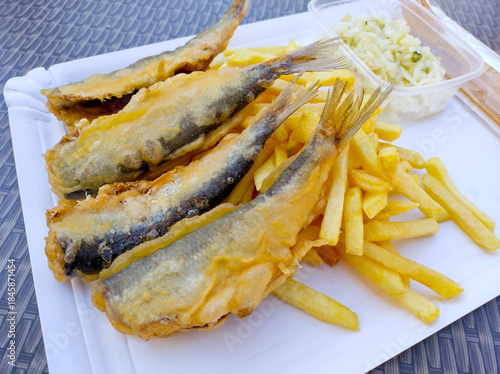 Delicious fried fish and chips with coleslaw