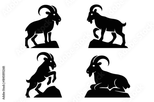 Four black mountain goat silhouettes standing and resting on rocky terrain