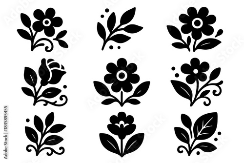 Collection of nine stylized floral motifs and botanical elements in black silhouette