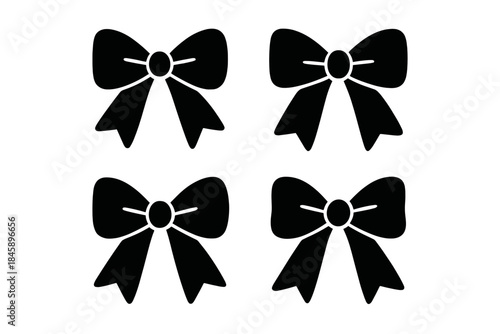 Four black decorative ribbon bows used for gifts and festive celebrations