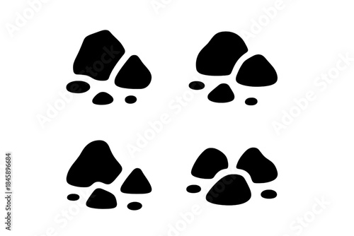 Four distinct black animal paw prints or tracks silhouettes on white