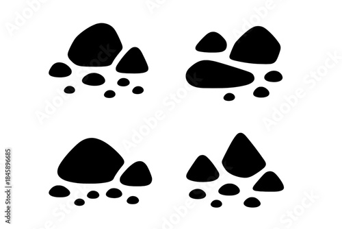 Four minimalist black silhouette icons of stacked stones or rock piles on white background
