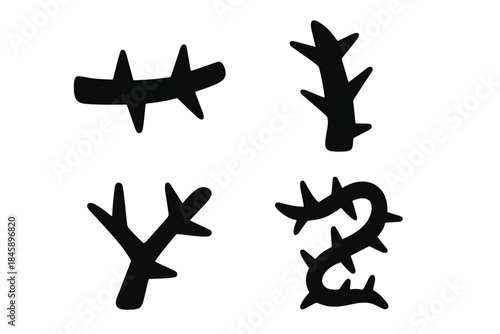 Four abstract black thorny branches and spiky organic shapes isolated on white
