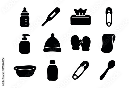 A collection of black silhouette icons representing essential baby care items and newborn supplies on a white background — stock vector.