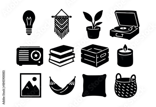 A collection of black silhouette icons representing various elements of home decor, leisure, and comfortable living in a minimalist flat design style — stock vector.